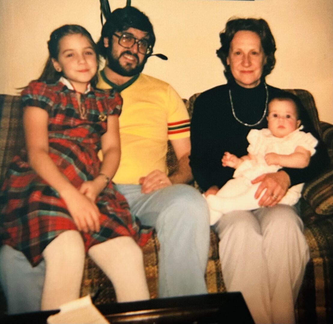 Multi-generational family portrait on living room couch